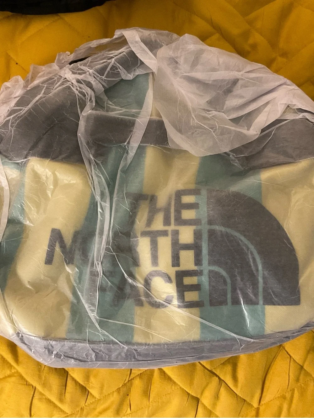 The North Face Yellow & Teal Striped Duffel Bag